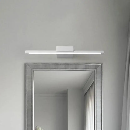 Modern white pole vanity lighting with sleek rectangular design mounted above framed mirror for bathroom use