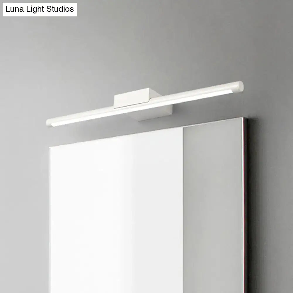 Modern white pole vanity lighting with warm white LED and sleek design mounted above a bathroom mirror