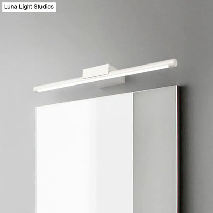 Modern white pole vanity lighting with warm white LED and sleek design mounted above a bathroom mirror