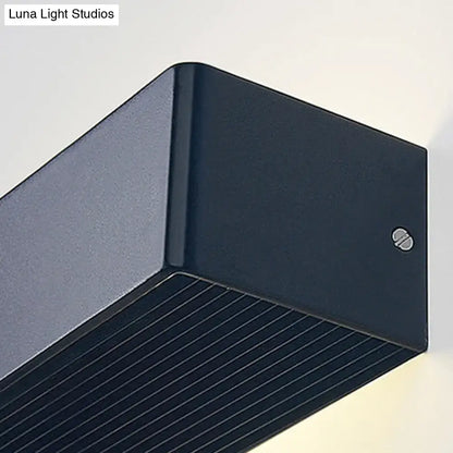 Dark blue rectangular outdoor wall lamp with matte finish and horizontal slats for warm white bedroom lighting