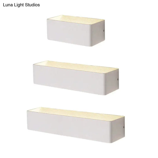 Set of three modern white rectangular wall lamps with warm white diffused lighting and textured top surface for bedrooms