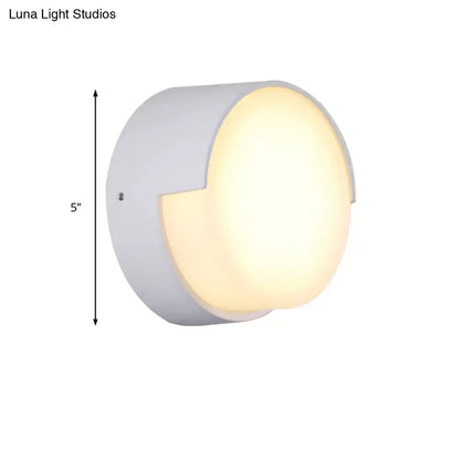 Modern white cylindrical direct wired wall light with warm white diffused glow for indoor hallway lighting