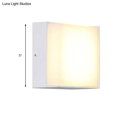 Modern white rectangular wall light with warm white LED glow direct wired for hallway lighting