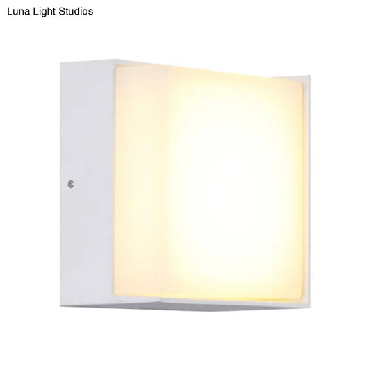 Modern white rectangular wall light with warm white diffused glow direct wired for hallway lighting