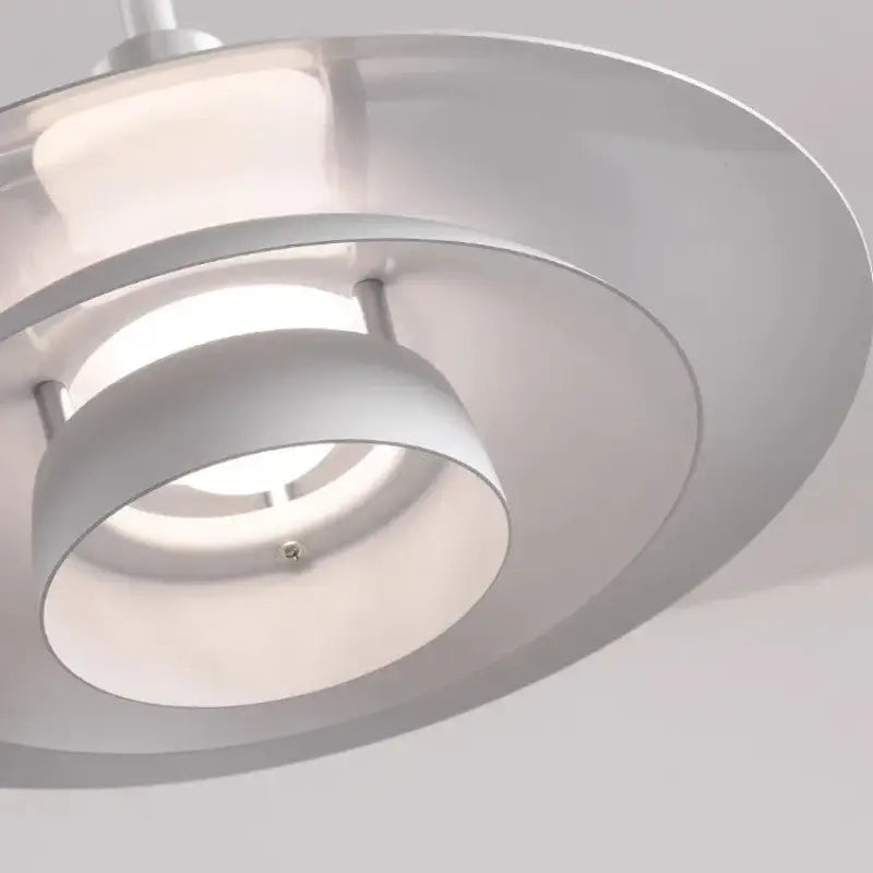 Modern white ufo pendant light with concentric rings and adjustable cord ideal for kitchen and modern interiors