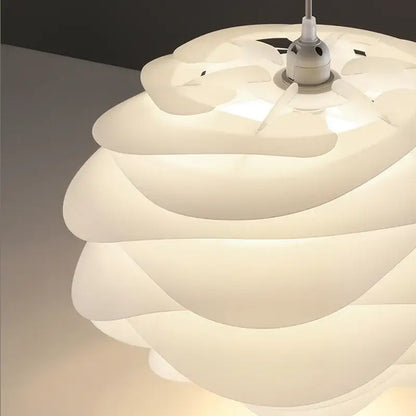 Modern white rose flower pendant lights with smooth translucent layered petals by decorbites carmina rose for bedroom decor