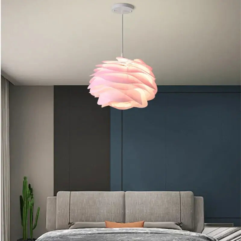 A soft pink layered rose flower pendant light with a modern design decorbites carmina rose for bedroom or living room