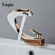 Modern white and rose gold basin faucet with elegant rose gold finish and sleek curved waterfall design