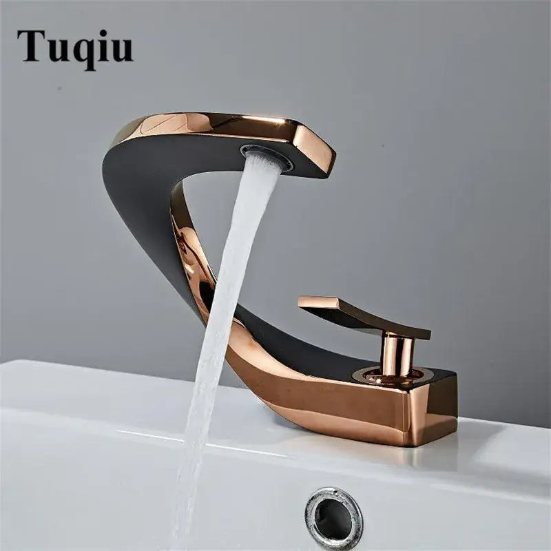 Modern white and rose gold basin faucet with elegant rose gold finish and sleek curved waterfall design
