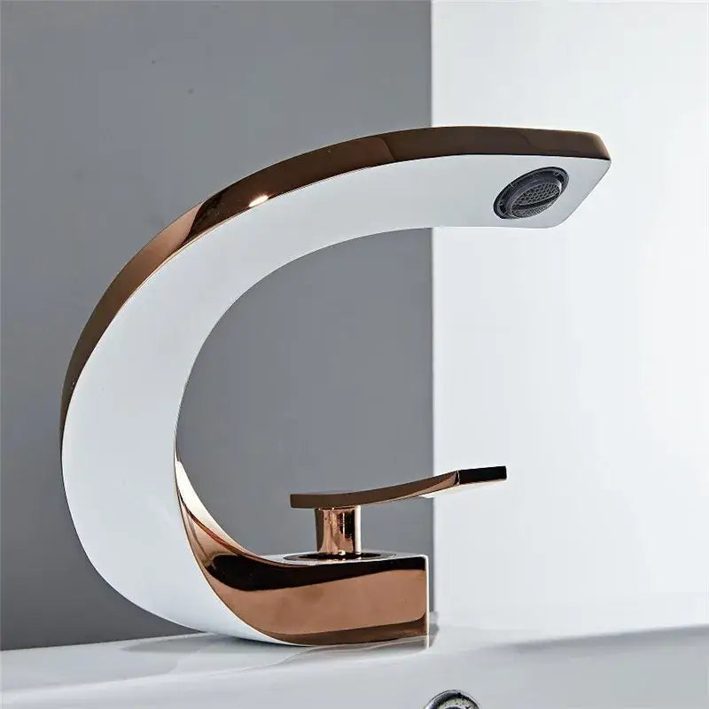 Modern white and rose gold basin faucet with elegant rose gold finish and sleek curved ceramic waterfall tap design