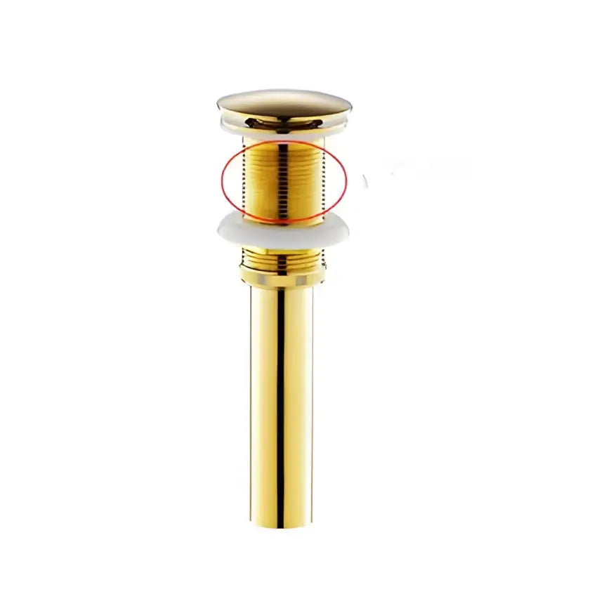 Gold-colored cylindrical bathroom sink drain with threaded top and white seal for elegant rose gold basin faucet use