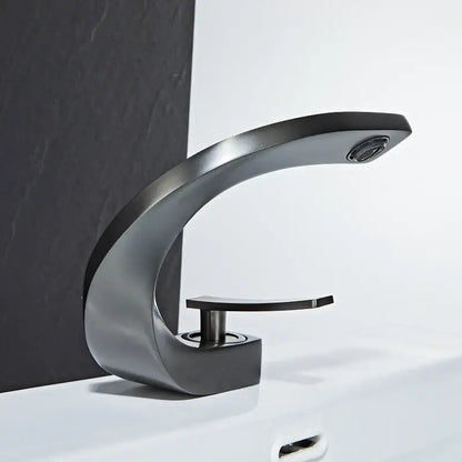 Modern matte black basin faucet with sleek curved design and single handle for elegant rose gold finish bathrooms