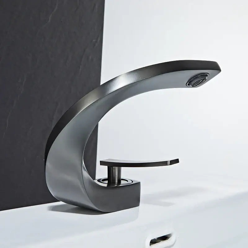 Modern matte black basin faucet with sleek curved design and single handle for elegant rose gold finish bathrooms