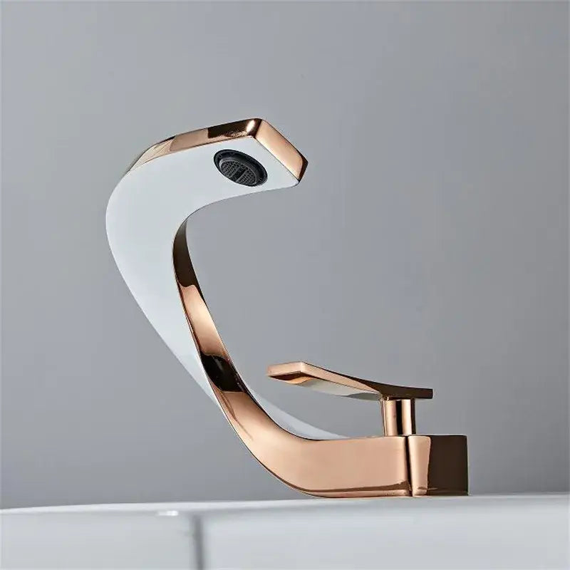 Modern white and rose gold basin faucet with elegant rose gold finish and sleek curved design for bathroom use
