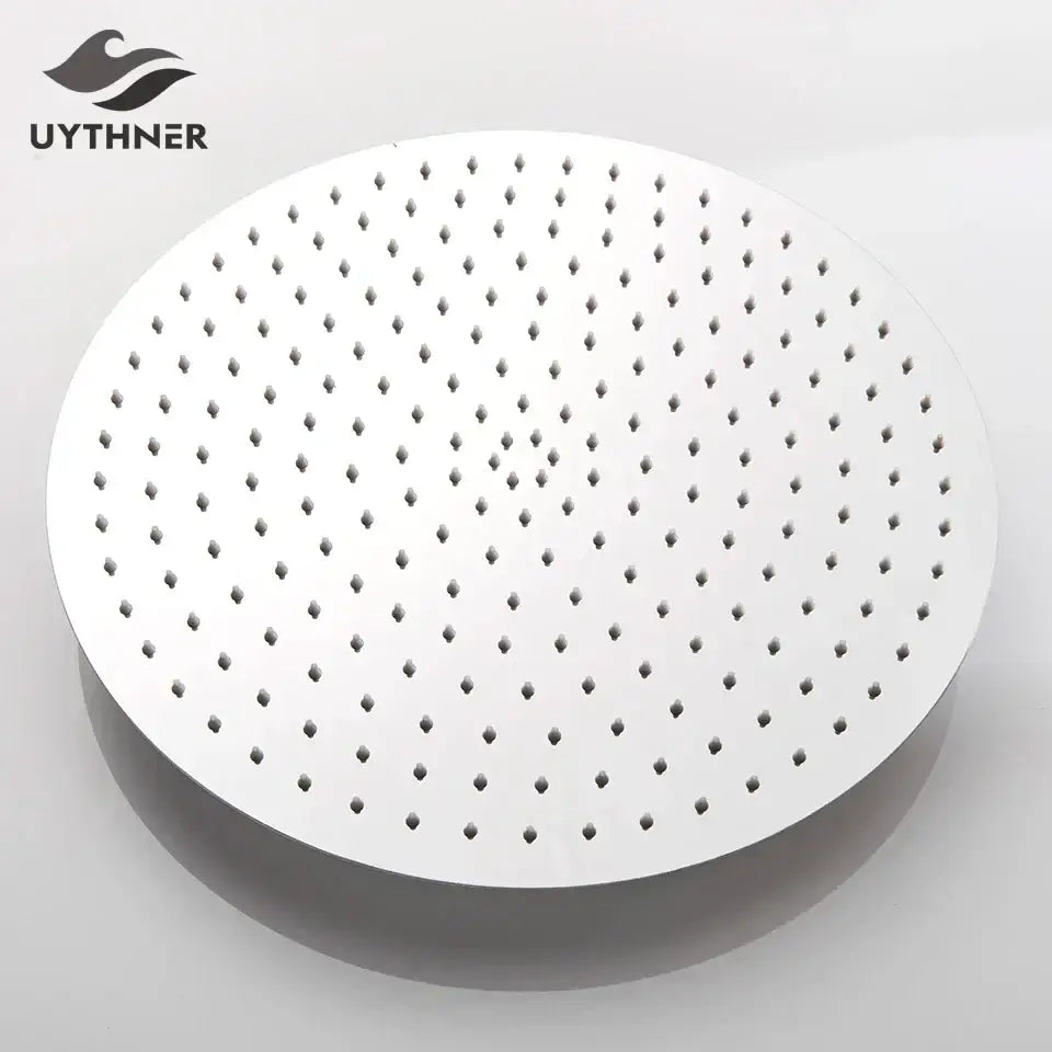 Modern white round rainfall shower head with evenly spaced perforations and sleek contemporary bathroom fixture design