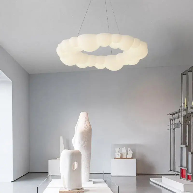 Modern white sculptural cloud living room ceiling lamp with cream-colored pendant light and soft diffused glow decorbites cloud living