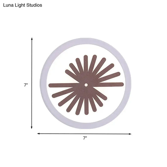 Modern white sector leaf pattern wall light with a circular white clock face and brown radial spokes for living room sconce