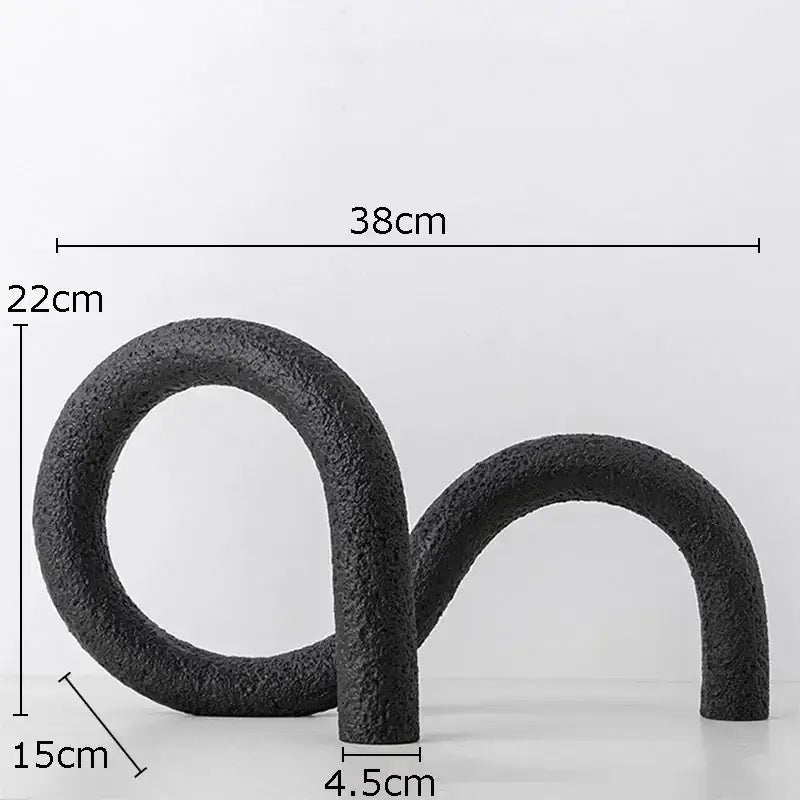 Modern black textured resin abstract twisted knot sculpture with s-shaped design for living room decor