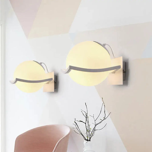 Modern white sphere opal glass wall sconce with warm frosted glass shades and direct wired electric for kitchen lighting