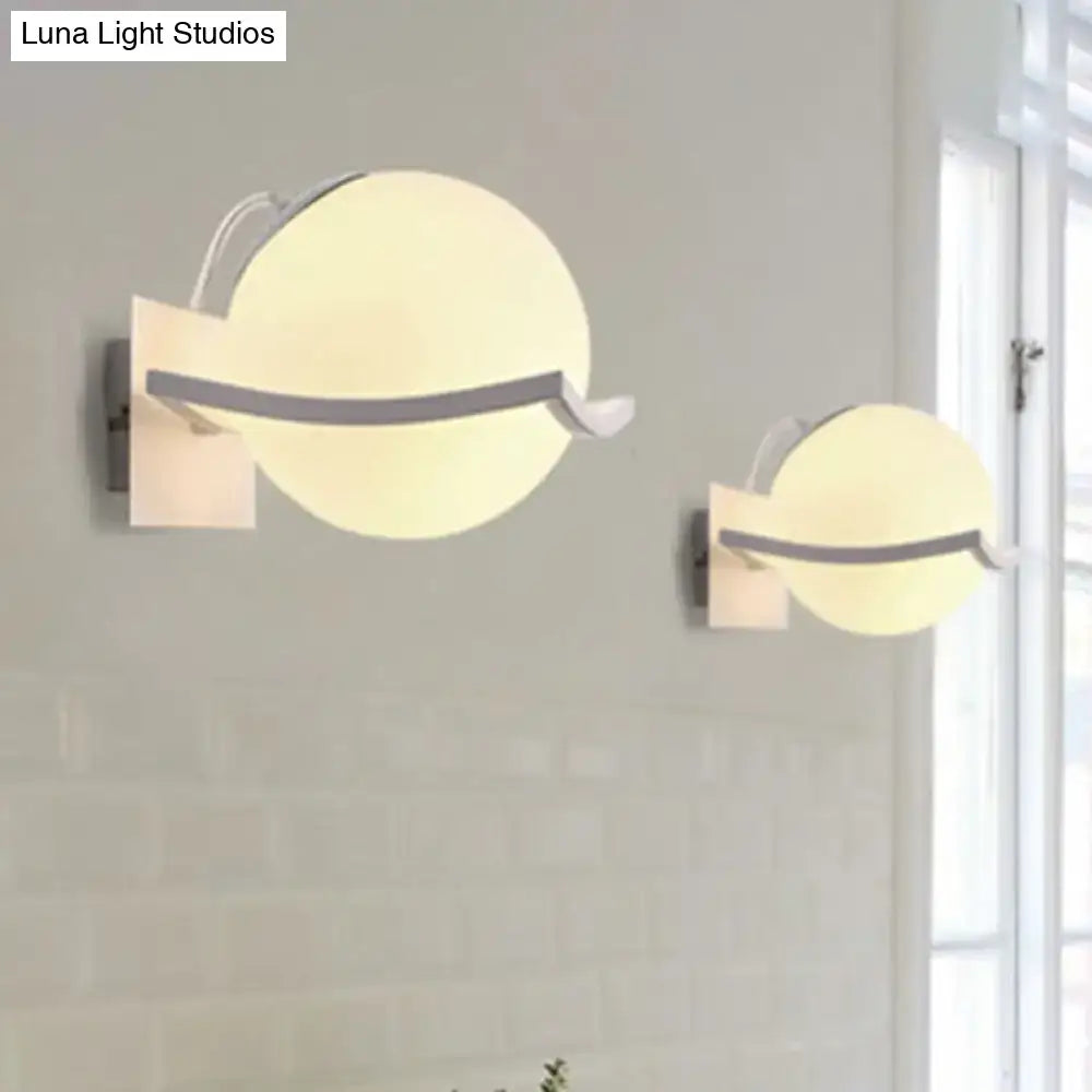 Modern white sphere opal glass wall sconce with direct wired electric and warm frosted diffuser for kitchen lighting