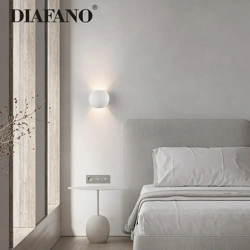 Modern white spherical gypsum led wall lamp with matte finish featuring diafano logo for bedroom sconce lighting