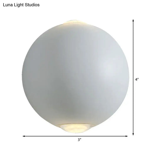 Modern white spherical wall light fixture with frosted glass and soft glowing interior for outdoor use