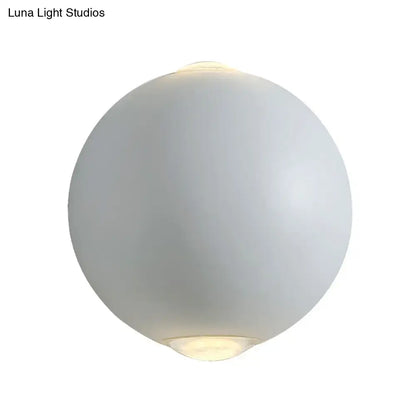 Modern white spherical wall light fixture with frosted glass and soft glow for outdoor use as an elegant wall light