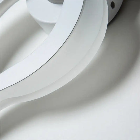 Modern white spiral led wall sconce featuring smooth curved layers in an 8 inch fixture suitable for corridor lighting