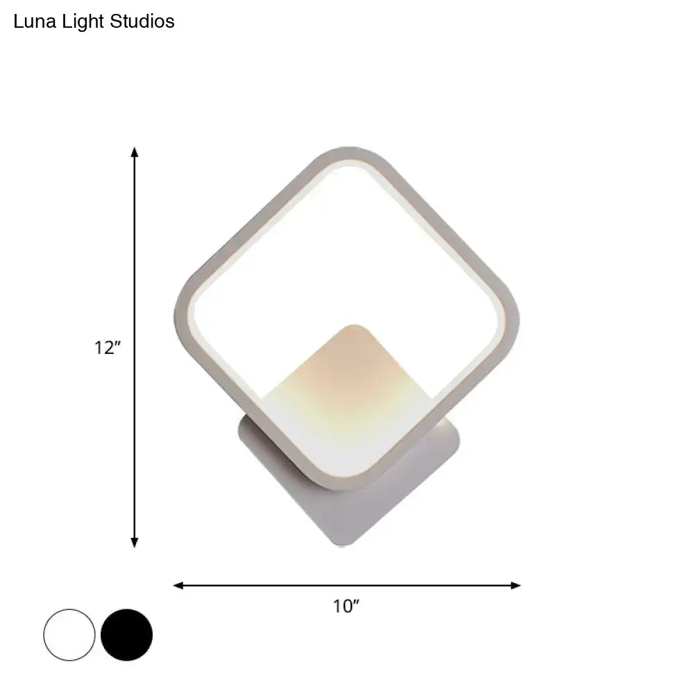 Modern white square bedside wall lamp with sleek frame and soft glowing light available in black and white finishes
