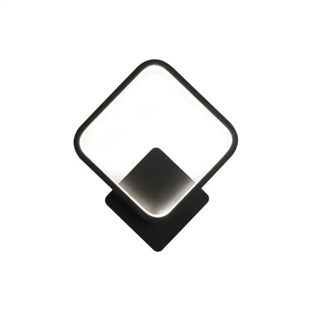 Modern black white bedside wall lamp with a LED diamond-shaped light panel and minimalist black-framed design