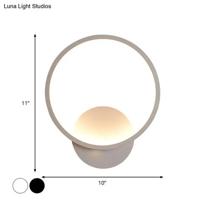 Modern white square bedside wall lamp with a sleek circular frame and warm glowing spherical light for minimalist lighting