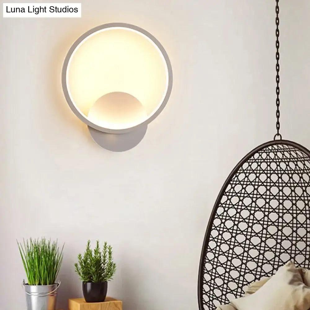 Modern gray circular wall lamp with sleek finish and warm light for minimalist black white bedside wall lighting