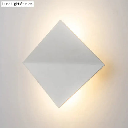Modern white square wall sconce with a direct wired electric connection and matte finish for living space lighting