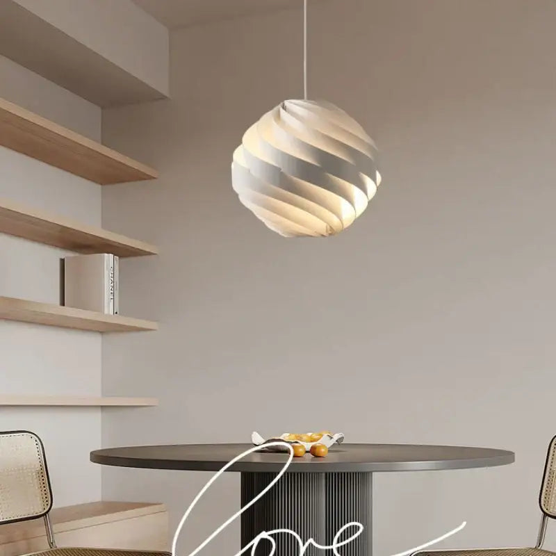 Modern white swirling spherical pendant light with sleek sculptural design decorbites designer pendant for dining room