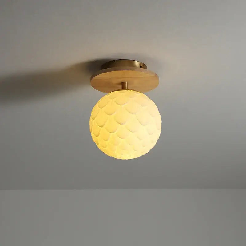 Modern white textured ceramic wood led ceiling light with warm yellow spherical shade and wooden base by decorbites ceramic wood