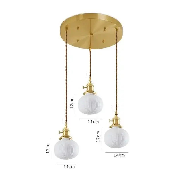 Gold-toned decorbites ceramic led pendant lights with three white ribbed glass globes suspended by twisted brown cords for kitchen decor