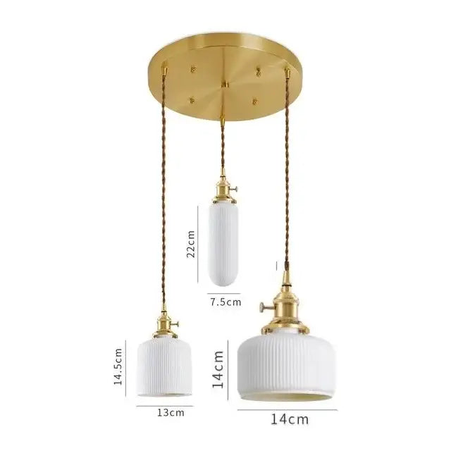 Set of three modern white textured glass ceramic led pendant lights with gold fixtures and braided cords for kitchen decor