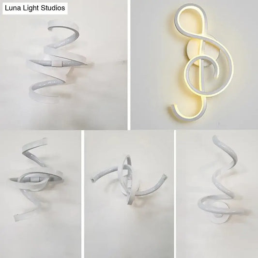 Modern white led wall sconce with a sleek spiraling design shaped as an illuminated treble clef for bedroom lighting