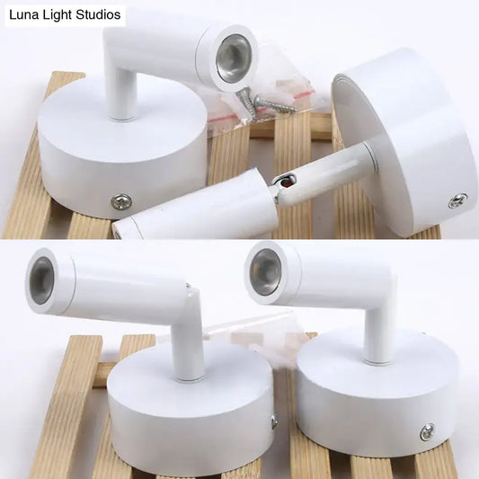 Modern white tube wall light featuring adjustable arms and metallic bases ideal as a white light bedroom sconce