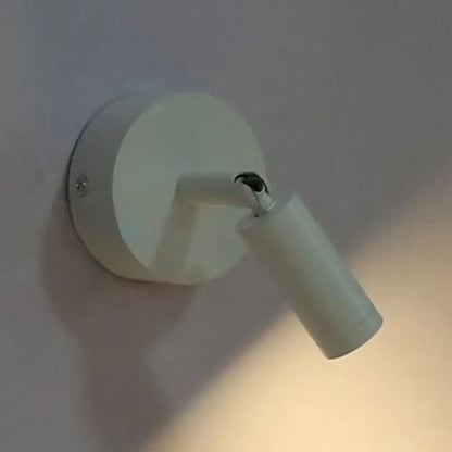 Modern white tube wall light with adjustable arm and cylindrical head ideal as a white light bedroom sconce