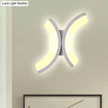 Modern white u-shaped led wall sconce with sleek curved design providing warm and white bedroom lighting