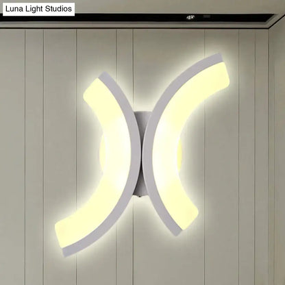 Modern white u-shaped led wall sconce with sleek curved arms emitting warm and white bedroom light