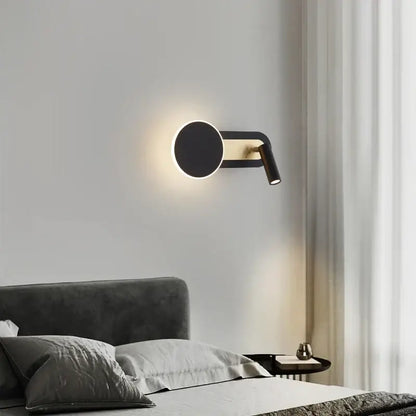 Modern black and gold led wall light with circular face and adjustable spotlight arm for living room decorbites led wall lighting