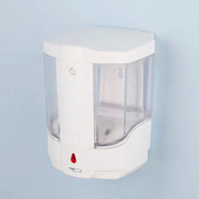 Modern white wall mounted automatic liquid soap dispenser with clear plastic sides and red sensor button for kitchen use