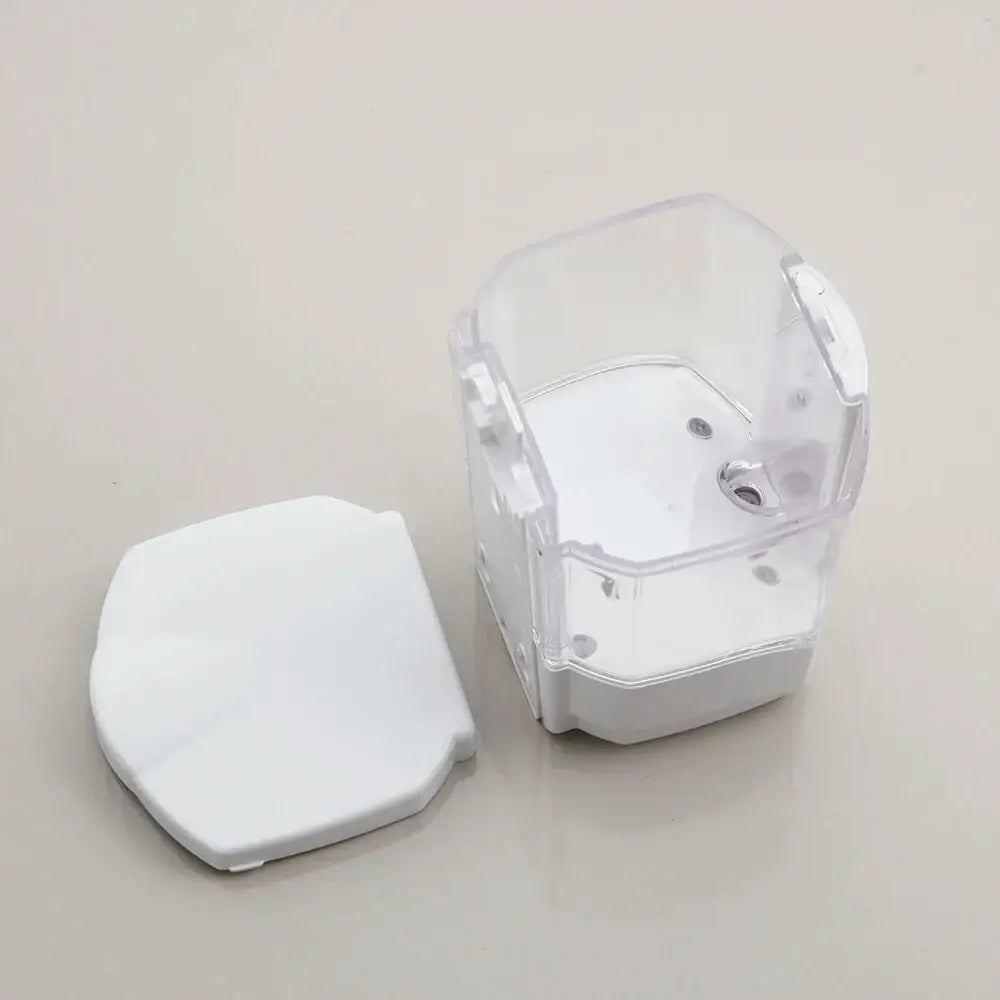 Clear plastic liquid soap dispenser with white lid and compartments for wall mounted automatic kitchen use