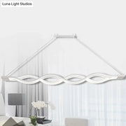 Modern white led pendant light with sleek wave-like design and minimalist frame for dining room island lighting