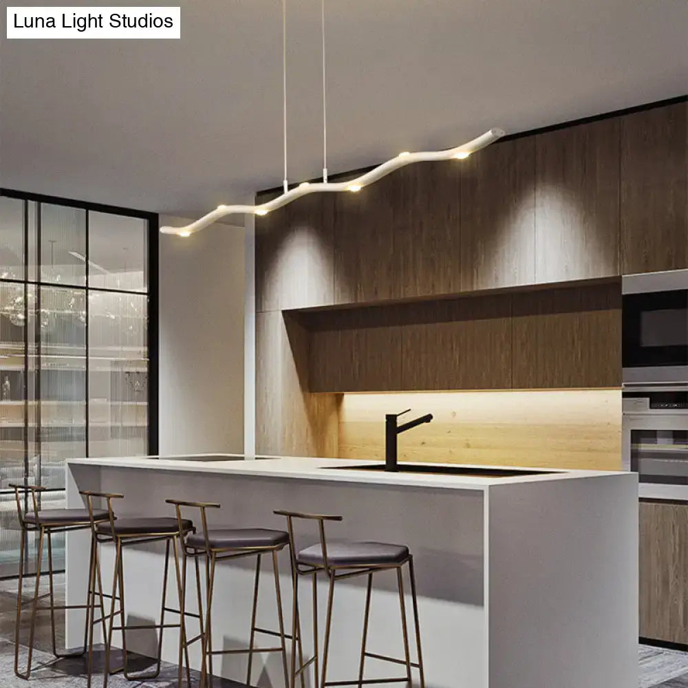 Modern white wave metal pendant light with sleek curved design and warm glow for kitchen island lighting fixture