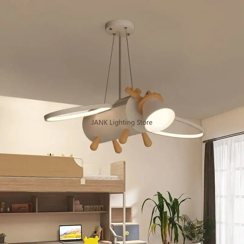 Modern white and wood airplane-shaped pendant light with circular led lights suitable as a deer led chandelier