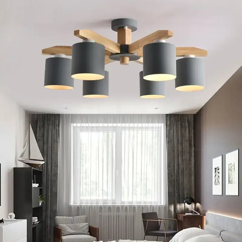 Modern white wood chandelier lighting fixture with five matte gray cylindrical shades on wooden crossbeam by decorbites iron
