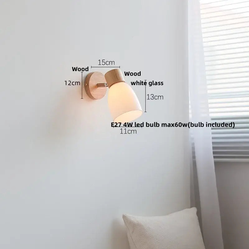 Minimalist wall sconce with natural wood base and white decorbites amber glass led shade for modern bedroom decor